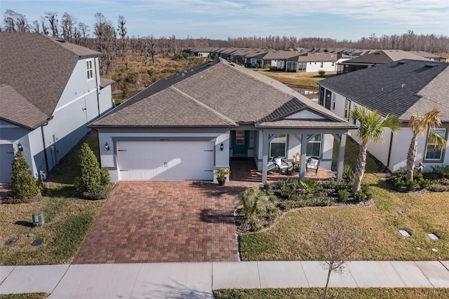 view of front facade with a garage and a front yard