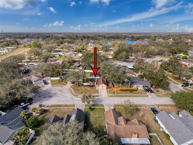 birds eye view of property featuring a residential view and a water view