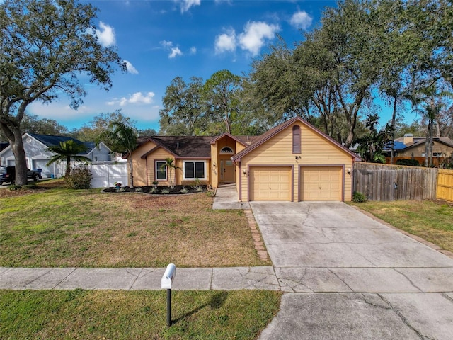 single story home featuring driveway, an attached garage, a front yard, and fence