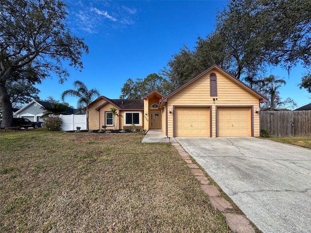 ranch-style home featuring an attached garage, concrete driveway, a front lawn, and fence