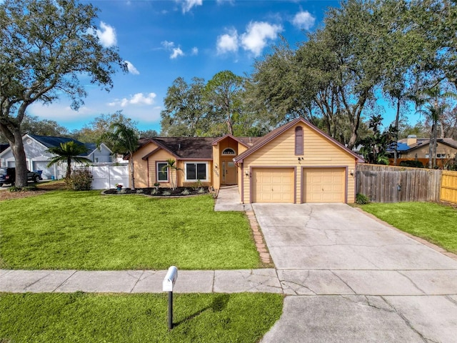 single story home featuring driveway, an attached garage, a front yard, and fence