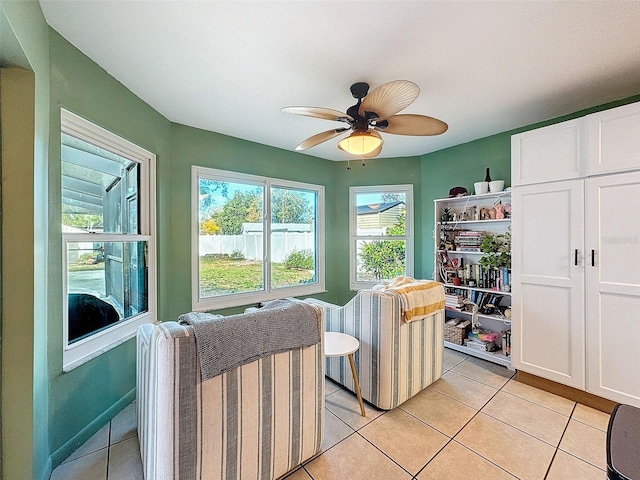 sitting room with light tile patterned flooring and ceiling fan