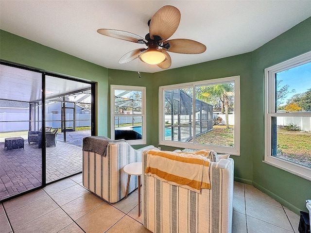 sunroom with ceiling fan