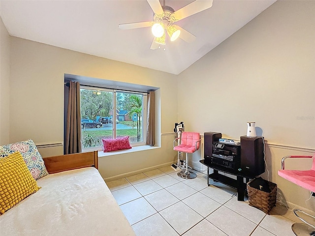 bedroom featuring vaulted ceiling, light tile patterned floors, baseboards, and ceiling fan