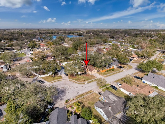 drone / aerial view with a water view and a residential view