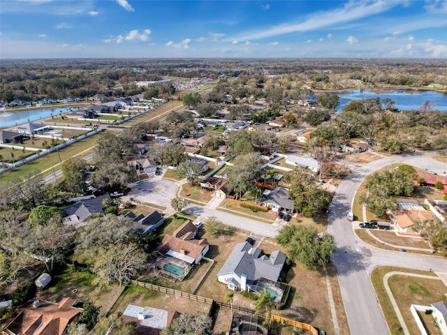 aerial view with a residential view and a water view