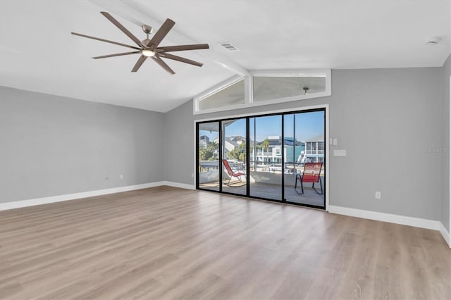 5925 Seaside Dr, New Port Richey, FL 34652 - spare room featuring ceiling fan, light hardwood / wood-style flooring, and vaulted ceiling with beams