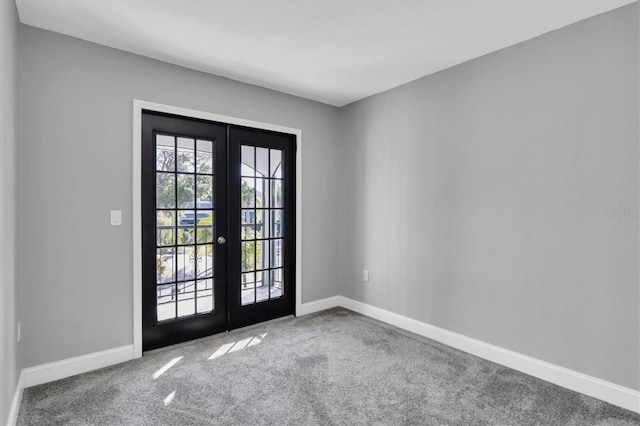 5925 Seaside Dr, New Port Richey, FL 34652 - entryway featuring french doors and carpet floors