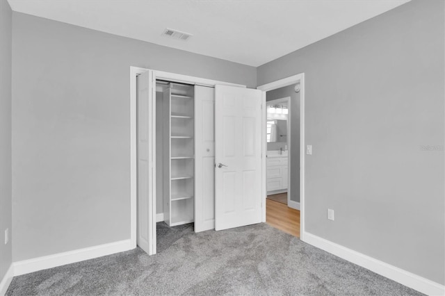 5925 Seaside Dr, New Port Richey, FL 34652 - unfurnished bedroom with a closet and carpet