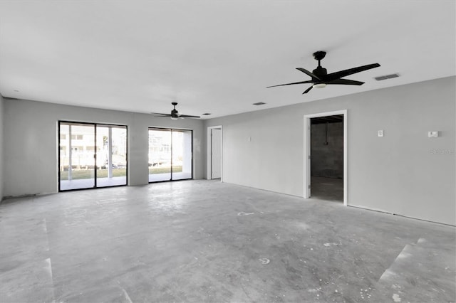 5925 Seaside Dr, New Port Richey, FL 34652 - spare room featuring concrete floors and ceiling fan