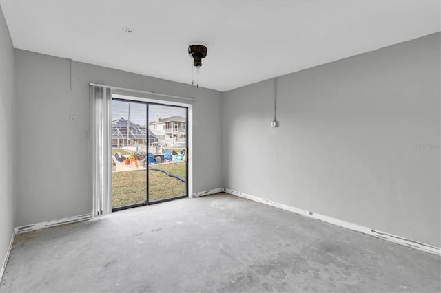 5925 Seaside Dr, New Port Richey, FL 34652 - spare room featuring concrete flooring