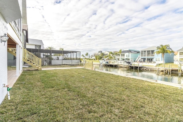 5925 Seaside Dr, New Port Richey, FL 34652 - view of yard with a boat dock and a water view