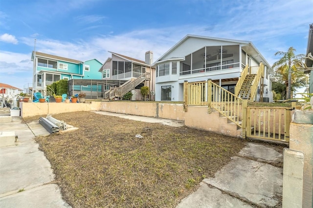 5925 Seaside Dr, New Port Richey, FL 34652 - view of front facade with a sunroom and ceiling fan