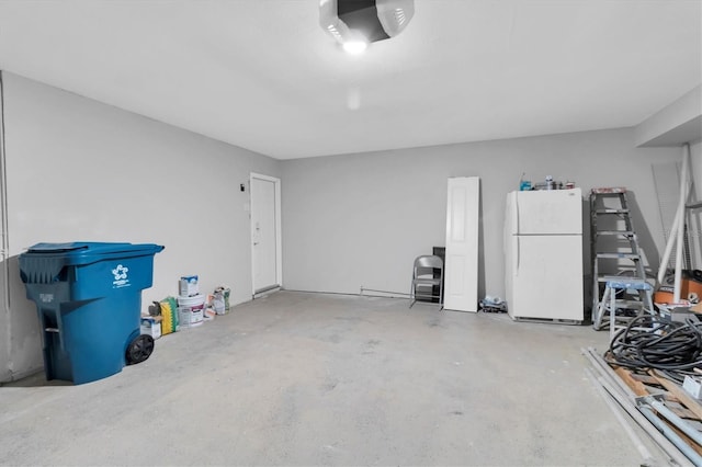 5925 Seaside Dr, New Port Richey, FL 34652 - garage featuring white refrigerator