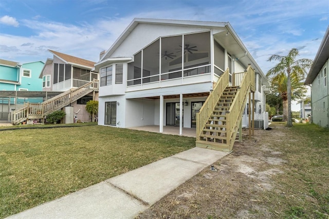 5925 Seaside Dr, New Port Richey, FL 34652 - rear view of property with a patio, a lawn, ceiling fan, central air condition unit, and a sunroom