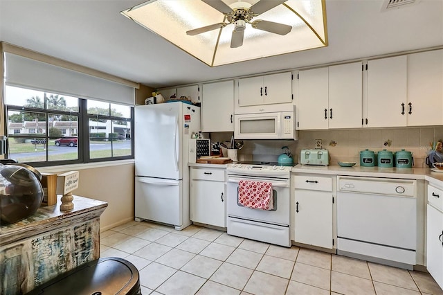 kitchen with tasteful backsplash, ceiling fan, white appliances, and white cabinets