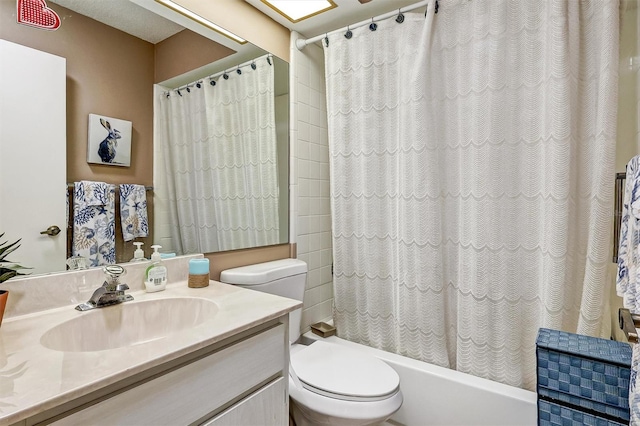 full bathroom with vanity, toilet, and shower / bath combo with shower curtain