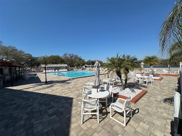 view of swimming pool featuring a patio area