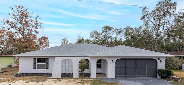 ranch-style home with a garage