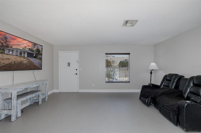 living room with a textured ceiling