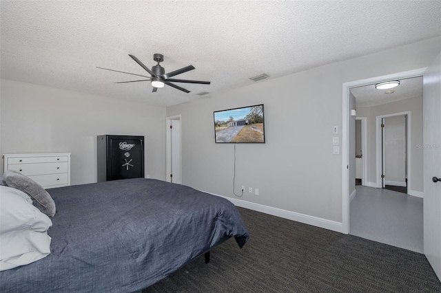 bedroom featuring ceiling fan and a textured ceiling