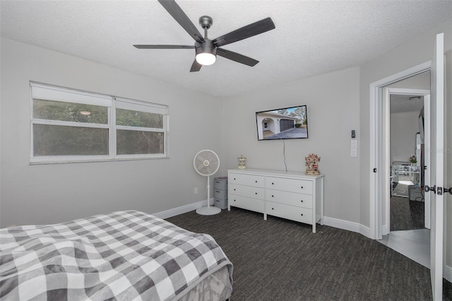 carpeted bedroom with ceiling fan and a textured ceiling