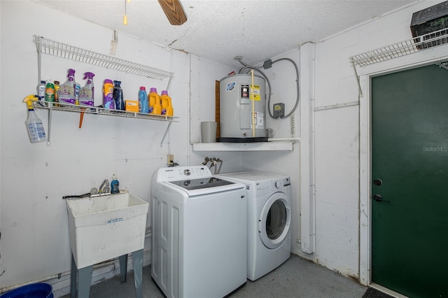 clothes washing area with sink, washing machine and dryer, electric water heater, and ceiling fan