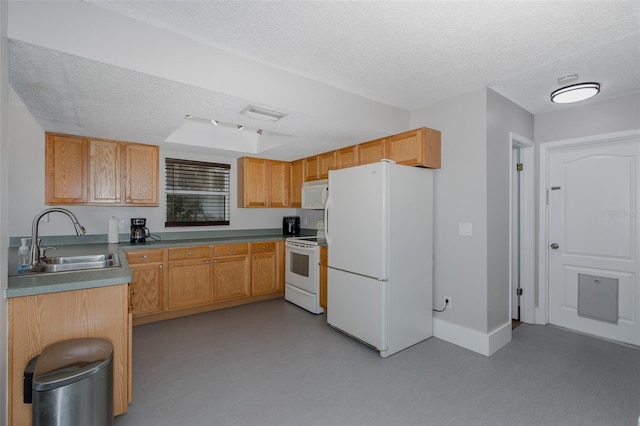 kitchen with white appliances, sink, and a textured ceiling