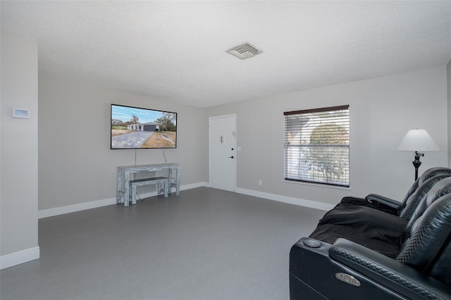 living room featuring a textured ceiling