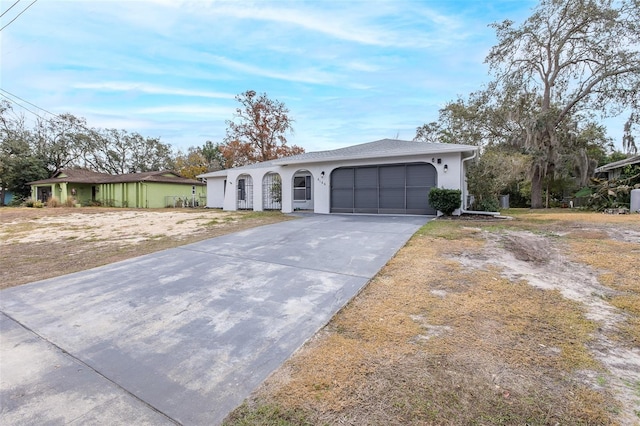 single story home with a garage