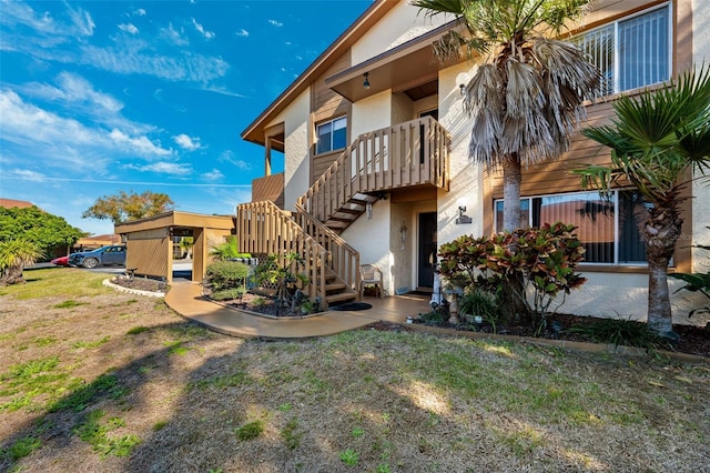 rear view of property featuring a yard