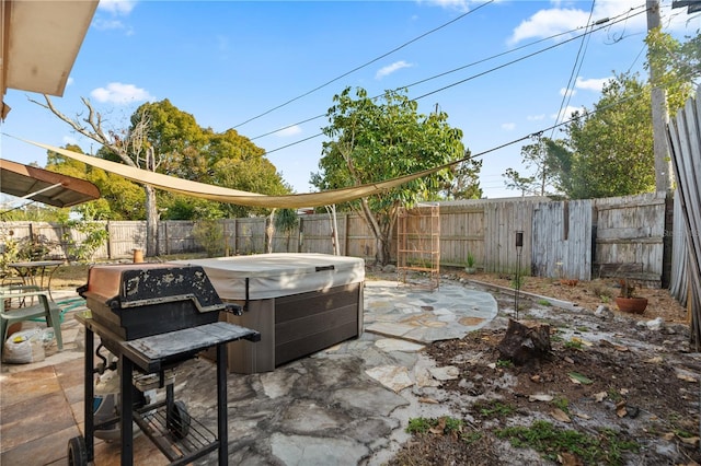 view of patio / terrace with a hot tub