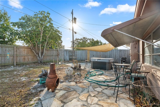 view of patio with a hot tub