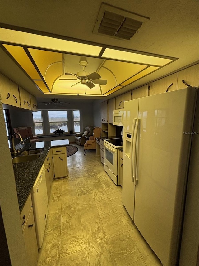 kitchen featuring ceiling fan, white appliances, kitchen peninsula, and sink