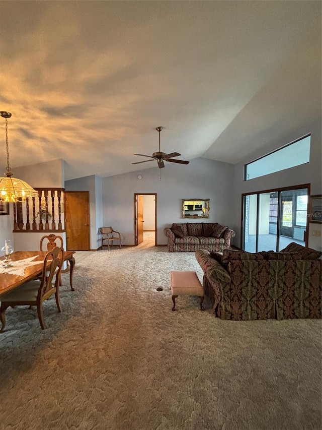 carpeted living room with lofted ceiling and ceiling fan