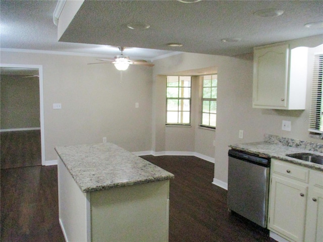 kitchen featuring white cabinetry, stainless steel dishwasher, ornamental molding, and dark hardwood / wood-style floors