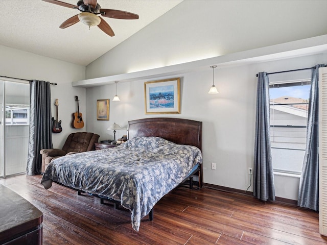 bedroom with ceiling fan, lofted ceiling, and dark hardwood / wood-style floors