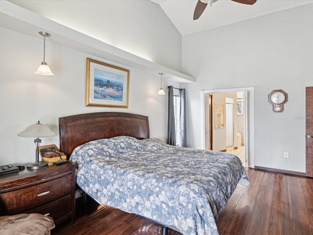 bedroom featuring ceiling fan, wood-type flooring, high vaulted ceiling, and ensuite bath