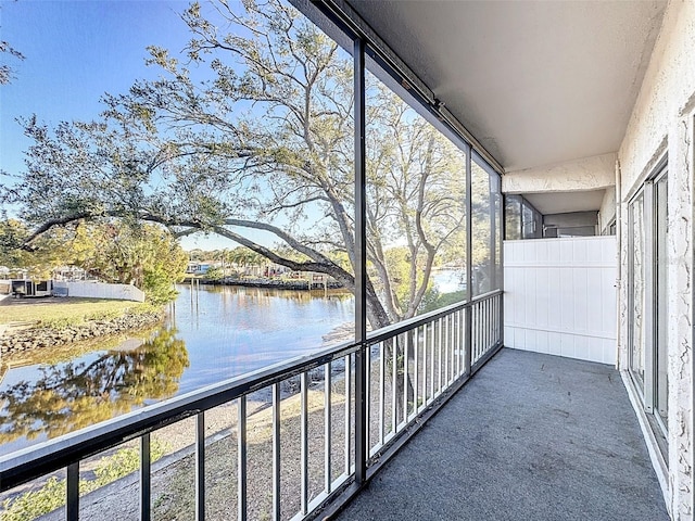 balcony featuring a water view