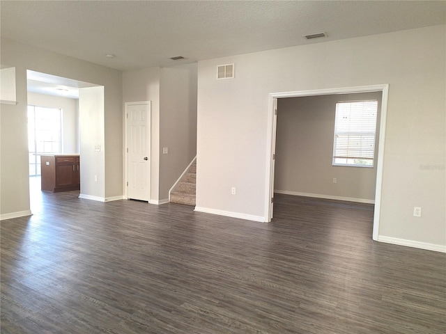 spare room featuring dark hardwood / wood-style floors