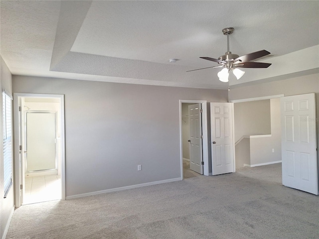 interior space featuring ceiling fan and a textured ceiling