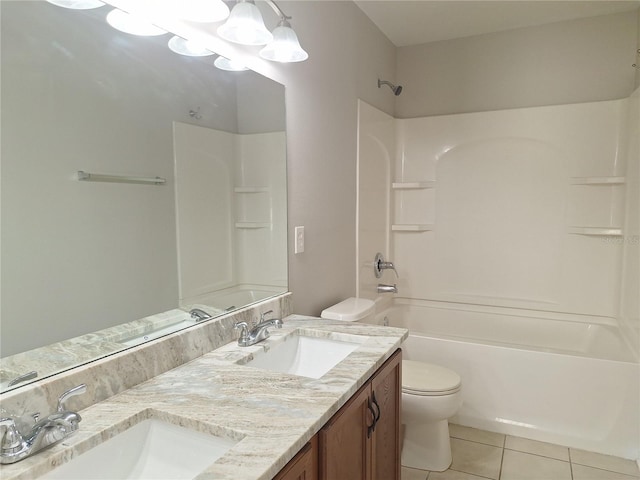 full bathroom with vanity, tile patterned floors, toilet, and shower / washtub combination