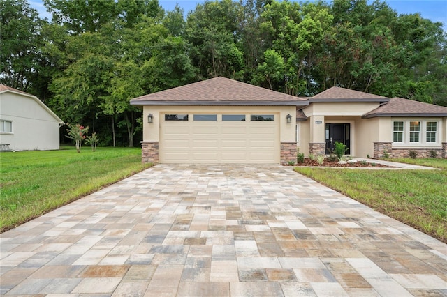 prairie-style home with a garage and a front lawn