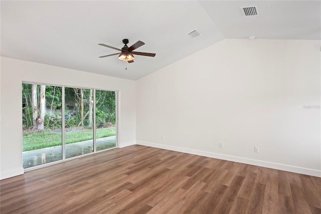 spare room featuring ceiling fan, wood-type flooring, and vaulted ceiling