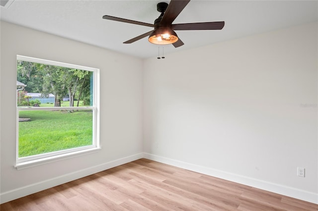 spare room featuring ceiling fan and light wood-type flooring