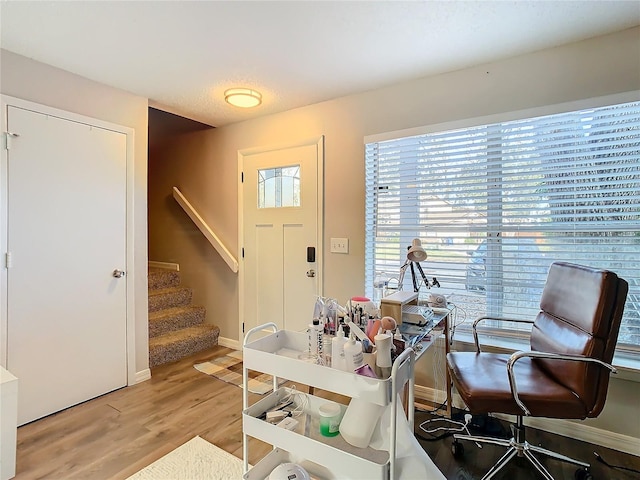 home office with wood-type flooring