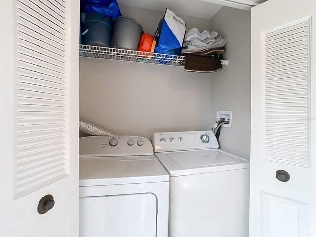 washroom featuring washer and clothes dryer