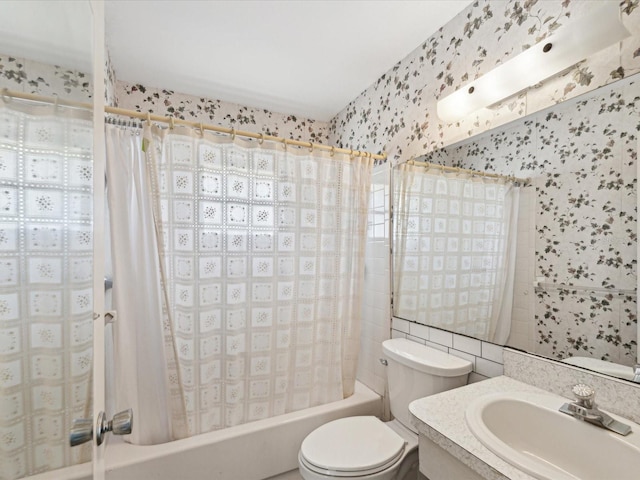 full bathroom with shower / bathtub combination with curtain, vanity, and toilet