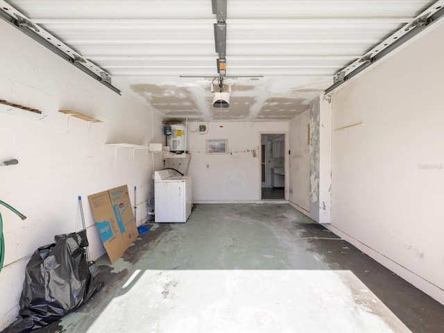 garage with a garage door opener and electric water heater