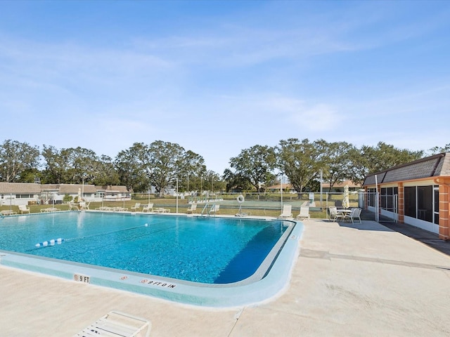 view of swimming pool featuring a patio